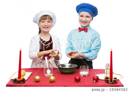 Children cooking christmas dessert Children cooking christmas dessert 19384562