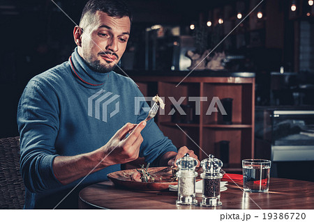 Handsome man at restaurant Handsome man at restaurant 19386720
