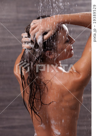 Beautiful girl is taking a shower with joy Beautiful girl is taking a shower with joy 19389529