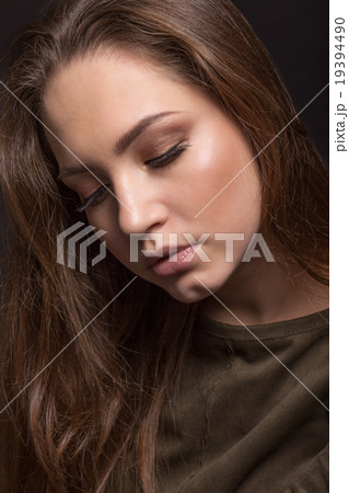 Portrait of the girl with closed eyes on a black background, gre Portrait of the girl with closed eyes on a black background, gre 19394490