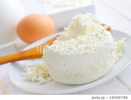 Milk products, fresh cottage in the white plate 19400786