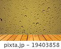 Wooden table with Abstract Water Drops on glass 19403858