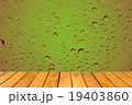 Wooden table with Abstract Water Drops on glass 19403860