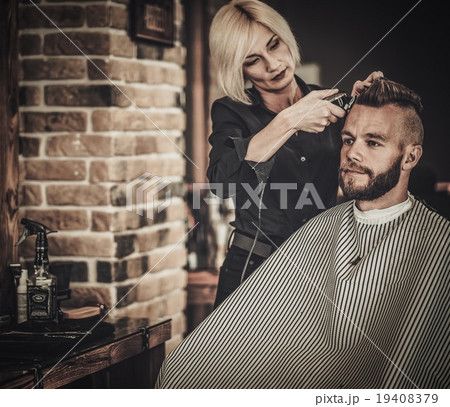 Client visiting hairstylist in barber shop Client visiting hairstylist in barber shop 19408379