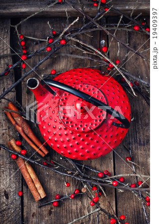 Kettle and branches with berries 19409397