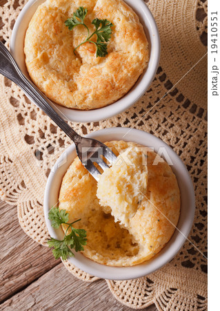 Cheese souffle in a ramekins close-up. vertical 19410551