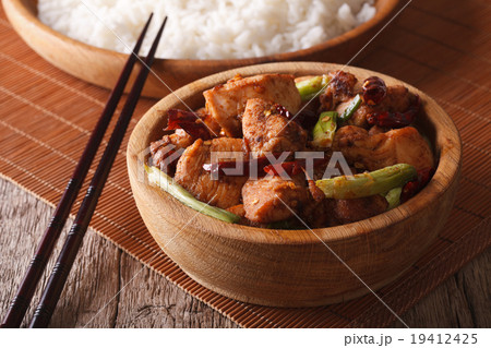 Kung pao chicken fillets in a bowl close up 19412425