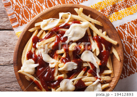 poutine - french fries with gravy and cheese 19412893