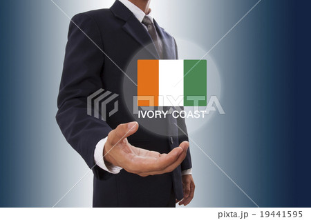 Businessman hand showing Ivory Coast flag  19441595