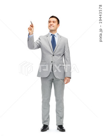 happy businessman in suit writing something happy businessman in suit writing something 19443578