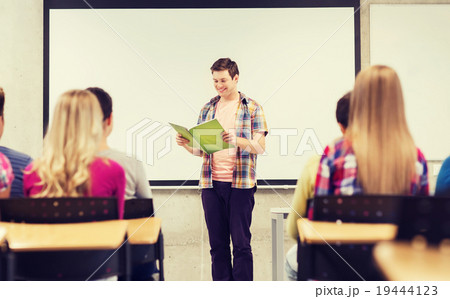 group of smiling students in classroom 19444123