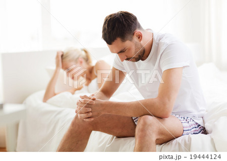unhappy couple having problems at bedroom 19444124