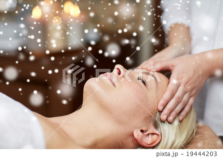 close up of woman having face massage in spa salon close up of woman having face massage in spa salon 19444203