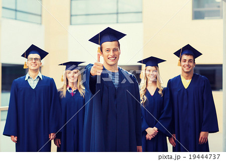 group of smiling students in mortarboards group of smiling students in mortarboards 19444737