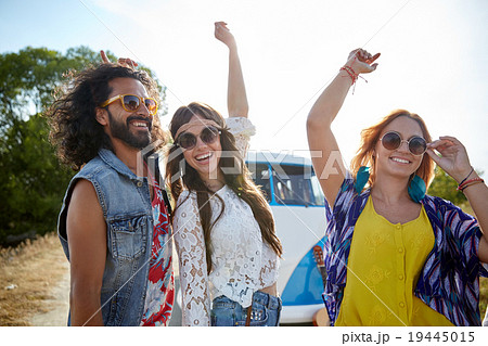 happy young hippie friends dancing outdoors happy young hippie friends dancing outdoors 19445015