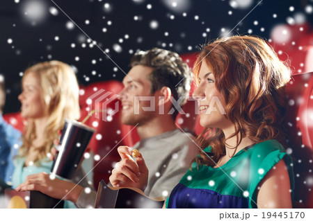happy friends with popcorn and drinks in cinema happy friends with popcorn and drinks in cinema 19445170