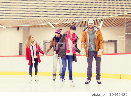 happy friends on skating rink happy friends on skating rink 19445422