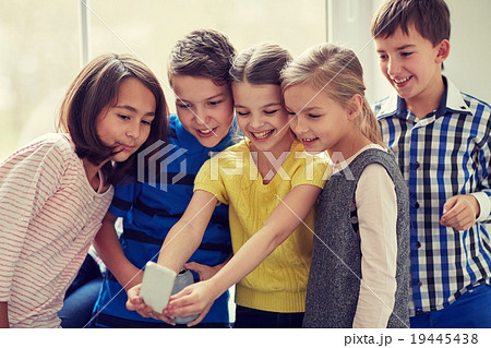group of school kids taking selfie with smartphone 19445438