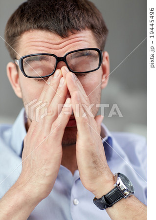 tired businessman with eyeglasses at office tired businessman with eyeglasses at office 19445496