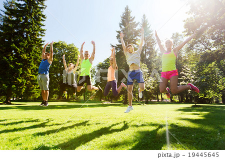 group of happy friends jumping high outdoors group of happy friends jumping high outdoors 19445645