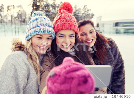 happy teenage girls taking selfie with smartphone 19446910