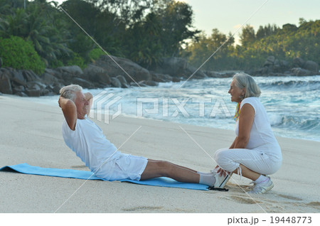 Senior couple exercising in summer Senior couple exercising in summer 19448773