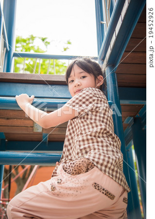 Asian girl is having fun in adventure park Asian girl is having fun in adventure park 19452926