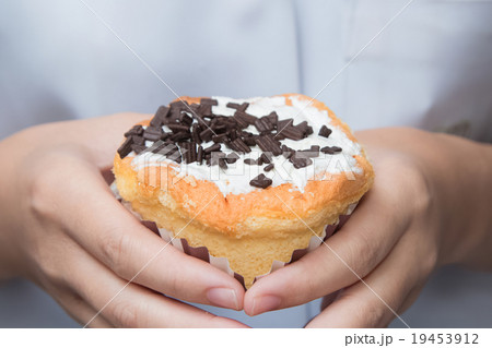 Woman holding beautiful cupcake, close up 19453912