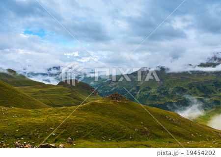The Grossglockner mountains in foggy weather The Grossglockner mountains in foggy weather 19454202