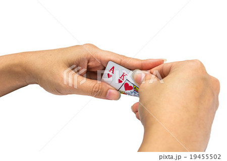 Playing cards in hand isolated on white background Playing cards in hand isolated on white background 19455502