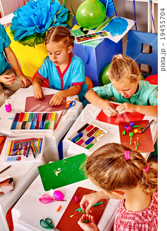 Group kids molded of plasticine table in 19455704