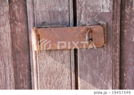 Old key on wood door Old key on wood door 19457349