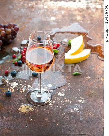 Glass of rose wine with berries, melon, grapes Glass of rose wine with berries, melon, grapes 19466706