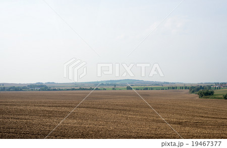 Fields with village and blue sky Fields with village and blue sky 19467377
