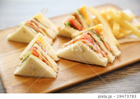 Club sandwich with on wood background Club sandwich with on wood background 19473783