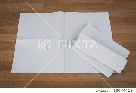 Blank Newspaper with empty space mock up on wood background Blank Newspaper with empty space mock up on wood background 19474418