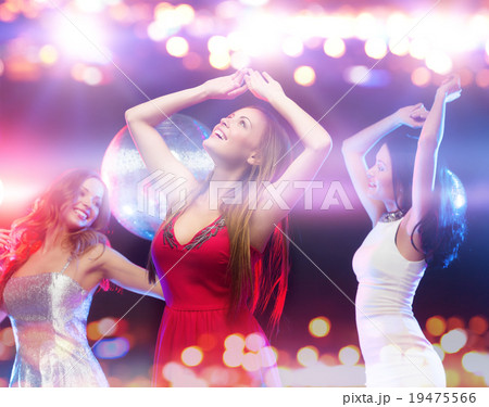 happy women dancing at night club happy women dancing at night club 19475566