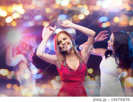 happy women dancing at night club happy women dancing at night club 19476876