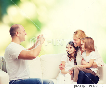happy family with camera at home happy family with camera at home 19477085