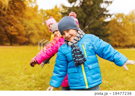 group of happy children having fun in autumn park 19477236