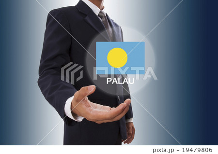 Businessman hand showing Palau Flag 19479806