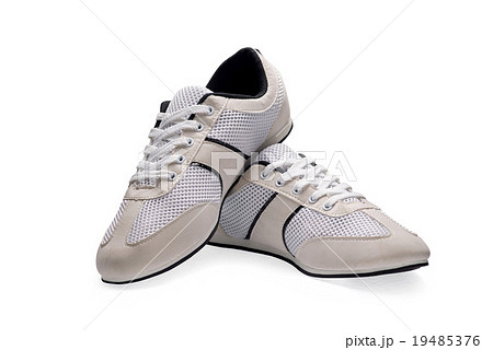 A pair of white sports shoes with shoelace A pair of white sports shoes with shoelace 19485376