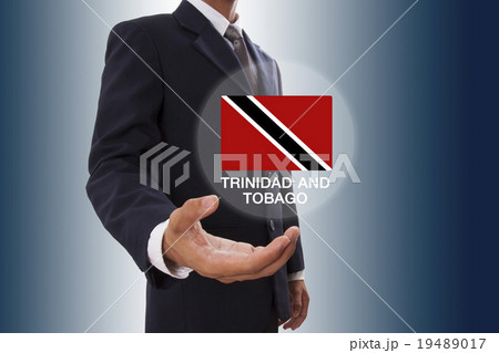 Businessman hand showing Trinidad and Tobago Flag  19489017