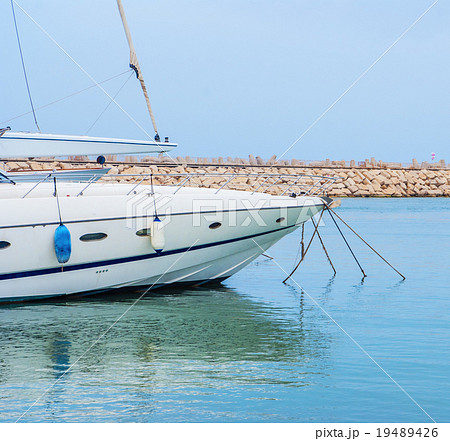 yacht in the harbor standing on an anchor 19489426