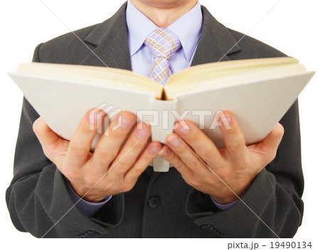 Man reads big book, isolated on white 19490134