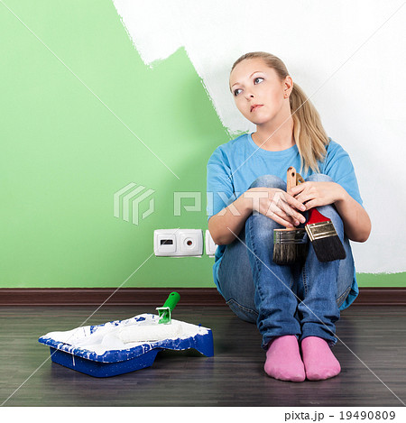 Unhappy woman with paint tools Unhappy woman with paint tools 19490809