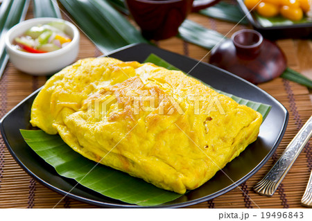 Stir fried tofu wrapped in omelett 19496843