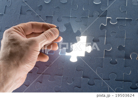Missing jigsaw puzzle piece with light glow Missing jigsaw puzzle piece with light glow 19503624