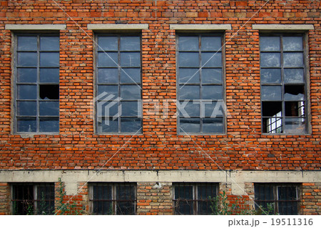 Old brick wall with broken windows Old brick wall with broken windows 19511316