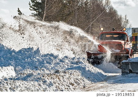 Snowplow removes snow Snowplow removes snow 19519853